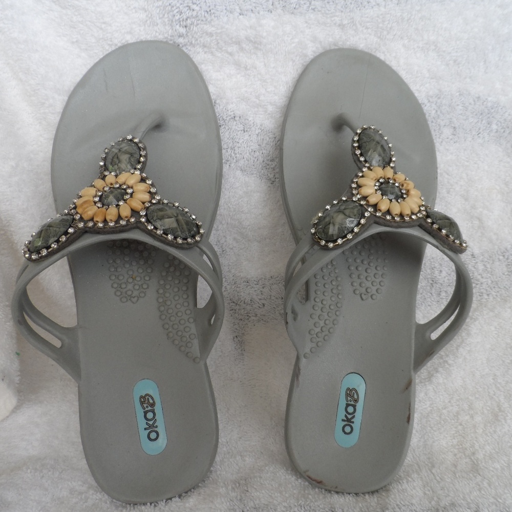 Gray bejeweled jelly flip flops size M from okaB